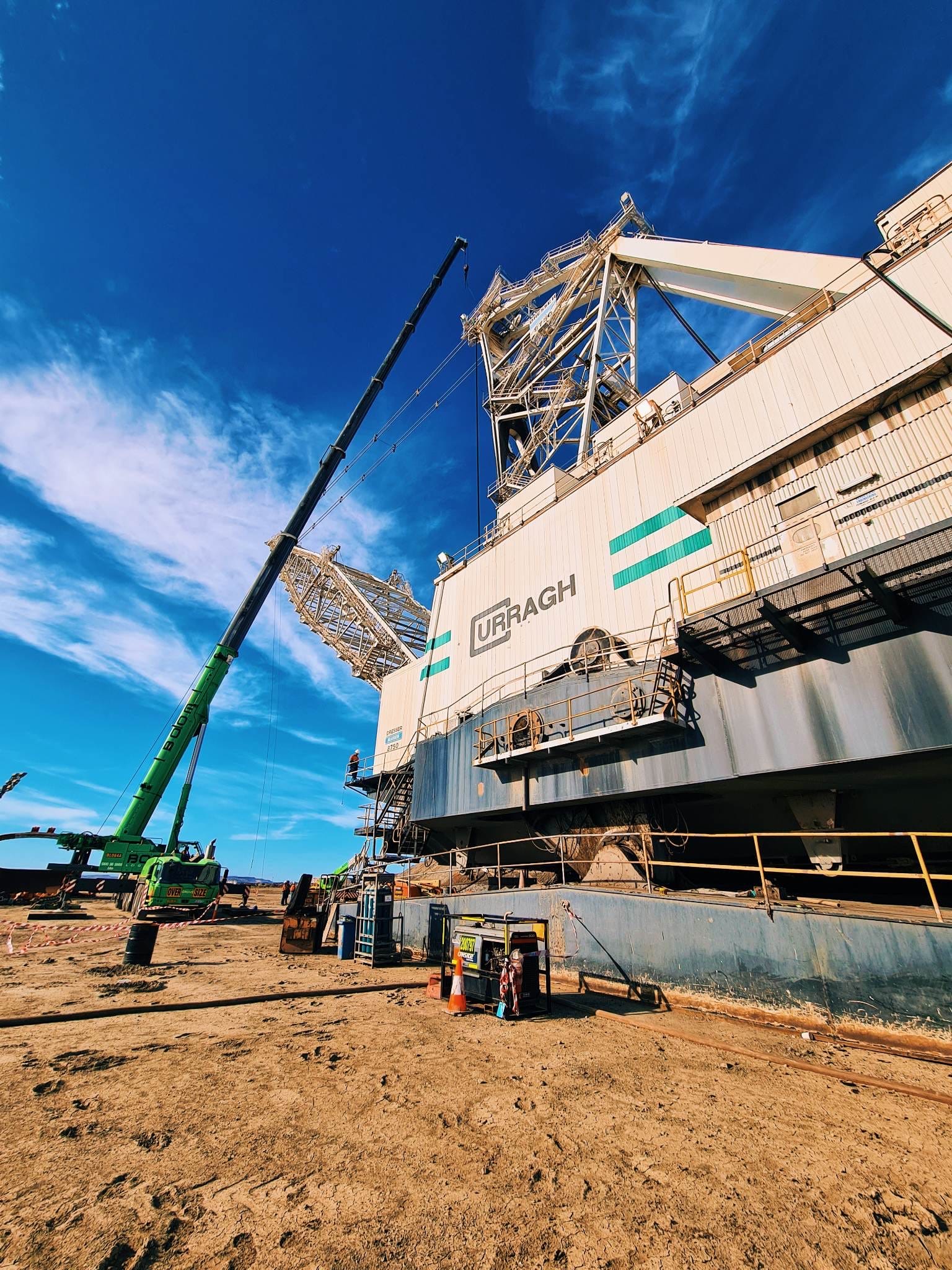 Mobile crane rigged alongside a dragline house during a major component change-out
